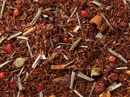 Rooibos Thee Citroen en Kruiden – losse thee met citroengras, kaneel en kardemom in theekopje.